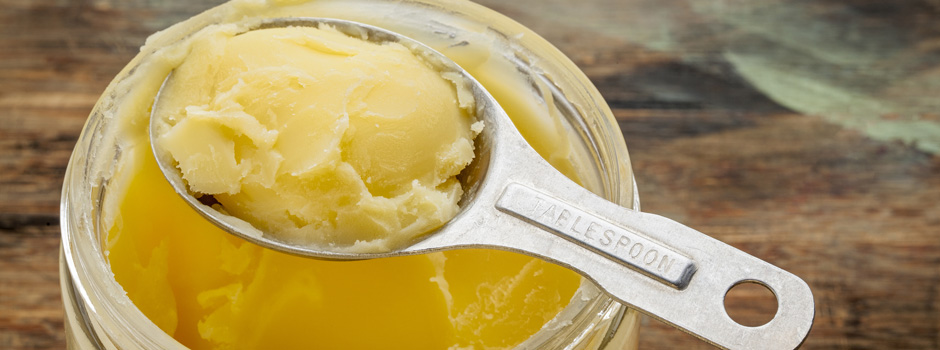 jar and tablespoon of ghee