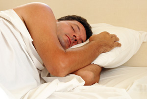 Man Sleeping In Bed