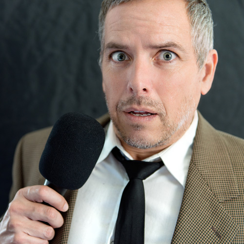 Anxious Man Speaks Into Microphone