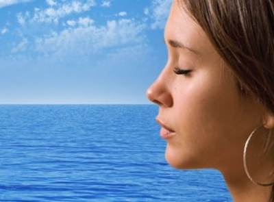 Meditating girl and ocean